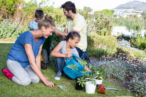 Garden maintenance professional discussing a service booking and site details