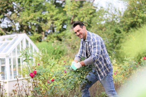 Garden maintenance staff following workplace safety responsibilities